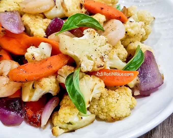 Tender crisp Cauliflower Shrimp Stir Fry with carrots and red onion. Super quick and easy to prepare. Great with a bowl of rice for a light and tasty meal. | RotiNRice.com #cauliflower #shrimp #stirfryrecipes